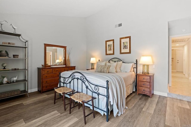 1740 Fire Mountain Dr, Oceanside, CA 92054 - bedroom with light wood-style flooring and high vaulted ceiling