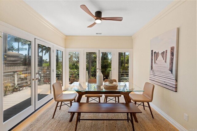 1740 Fire Mountain Dr, Oceanside, CA 92054 - dining space featuring plenty of natural light, a ceiling fan, crown molding, and wood finished floors