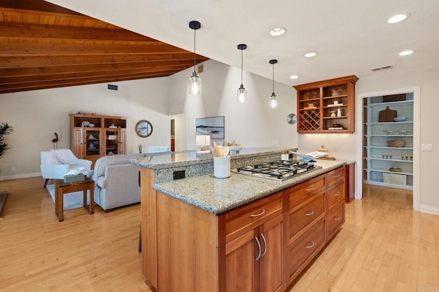 1740 Fire Mountain Dr, Oceanside, CA 92054 - kitchen featuring open shelves, light wood-type flooring, recessed lighting, hanging light fixtures, and light stone countertops