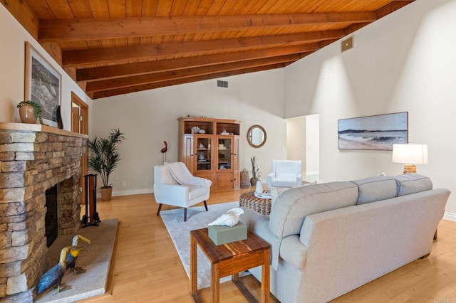1740 Fire Mountain Dr, Oceanside, CA 92054 - living area featuring wooden ceiling, light wood finished floors, and a stone fireplace
