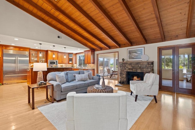 1740 Fire Mountain Dr, Oceanside, CA 92054 - living area with a wooden ceiling with exposed beams, french doors, healthy amount of natural light, light wood-type flooring, and recessed lighting