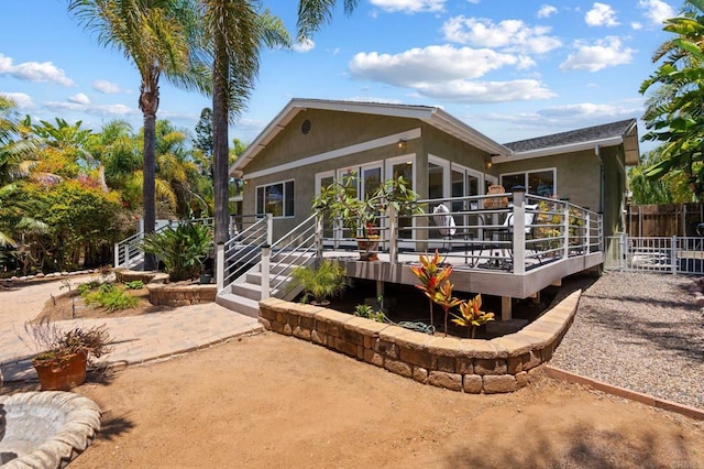 1740 Fire Mountain Dr, Oceanside, CA 92054 - rear view of property with a patio, a deck, and stucco siding