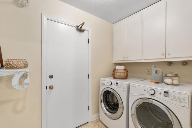 1740 Fire Mountain Dr, Oceanside, CA 92054 - washroom with cabinet space, washing machine and clothes dryer, and light tile patterned flooring