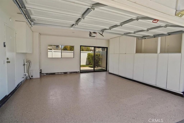 1138 N Valley St, Burbank, CA 91505 - garage featuring a garage door opener and baseboards