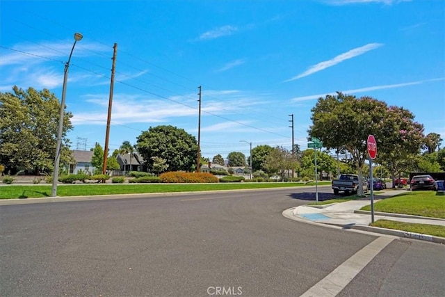 1138 N Valley St, Burbank, CA 91505 - view of asphalt road featuring street lights, traffic signs, curbs, and sidewalks