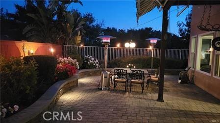 14213 Aliso Ct, Chino Hills, CA 91709 - patio at night with outdoor dining area and a patio area