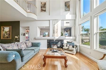 14213 Aliso Ct, Chino Hills, CA 91709 - living area featuring a high ceiling, healthy amount of natural light, and wood finished floors