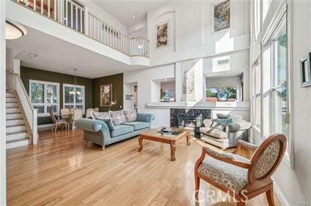 14213 Aliso Ct, Chino Hills, CA 91709 - living room with a high ceiling, stairs, and wood finished floors