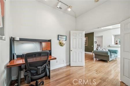 14213 Aliso Ct, Chino Hills, CA 91709 - home office with light wood-type flooring and high vaulted ceiling