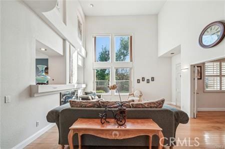 14213 Aliso Ct, Chino Hills, CA 91709 - living area featuring a high ceiling and light wood-type flooring