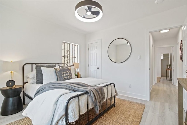 215 E 107th St, Los Angeles, CA 90003 - bedroom featuring light wood-style floors and baseboards