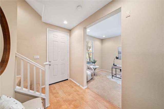 118 Vintage Unit 18, Irvine, CA 92620 - foyer entrance featuring light wood finished floors, stairs, and recessed lighting