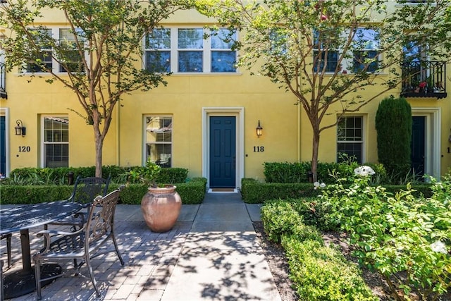 118 Vintage Unit 18, Irvine, CA 92620 - property entrance featuring stucco siding and a patio