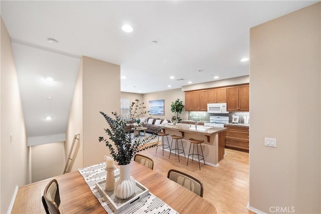 118 Vintage Unit 18, Irvine, CA 92620 - dining area with light wood-style floors and recessed lighting