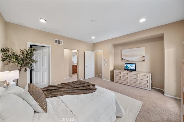 118 Vintage Unit 18, Irvine, CA 92620 - bedroom with light colored carpet, recessed lighting, and ensuite bath