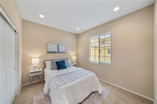 118 Vintage Unit 18, Irvine, CA 92620 - bedroom with light colored carpet, a closet, and recessed lighting