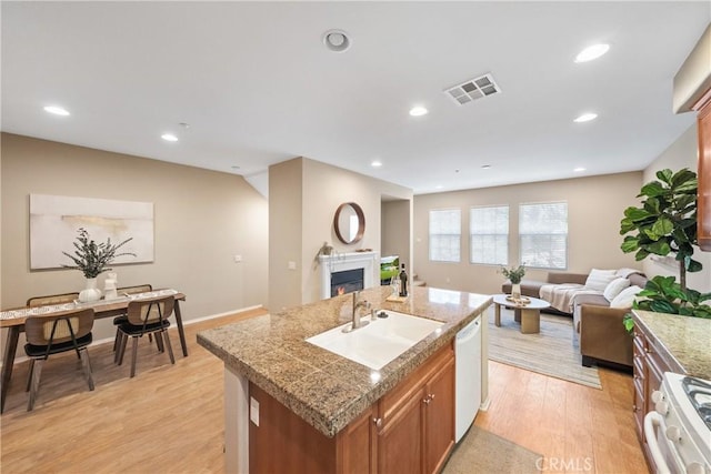 118 Vintage Unit 18, Irvine, CA 92620 - kitchen featuring open floor plan, white appliances, tile countertops, brown cabinets, and recessed lighting