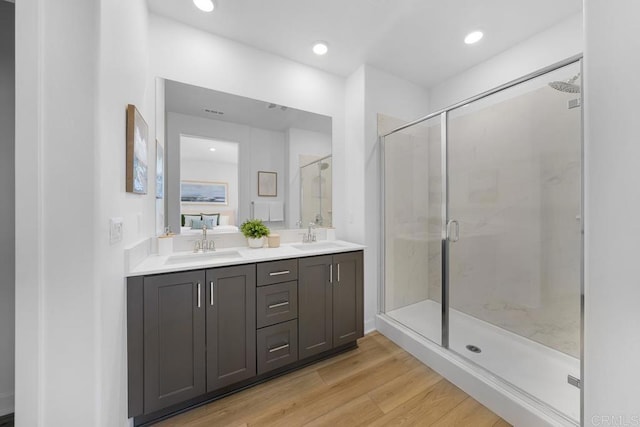 766 Makani St Unit 1, Chula Vista, CA 91911 - bathroom featuring double vanity, a stall shower, wood finished floors, and recessed lighting