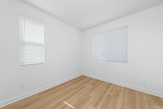 766 Makani St Unit 1, Chula Vista, CA 91911 - spare room featuring baseboards and light wood-style floors