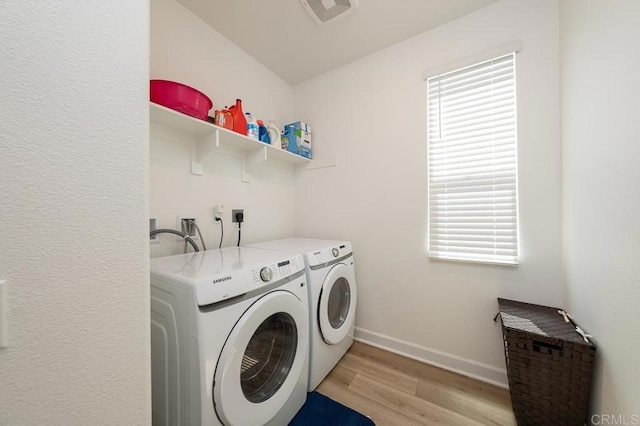 766 Makani St Unit 1, Chula Vista, CA 91911 - laundry area featuring washing machine and clothes dryer and light wood-type flooring