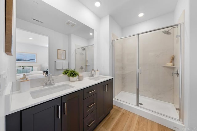 766 Makani St Unit 1, Chula Vista, CA 91911 - bathroom with double vanity, wood finished floors, a shower stall, ensuite bathroom, and recessed lighting