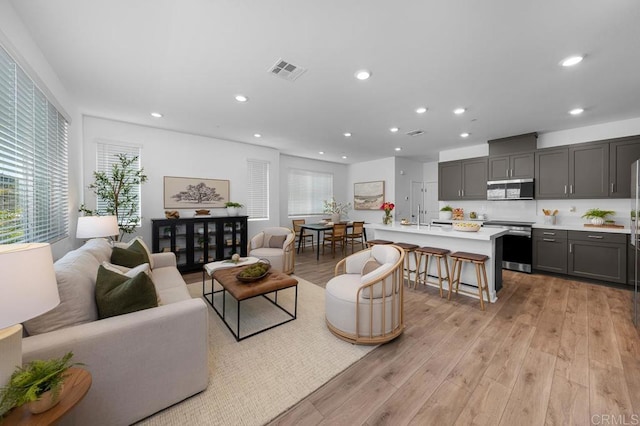 766 Makani St Unit 1, Chula Vista, CA 91911 - living area featuring healthy amount of natural light, recessed lighting, and light wood finished floors