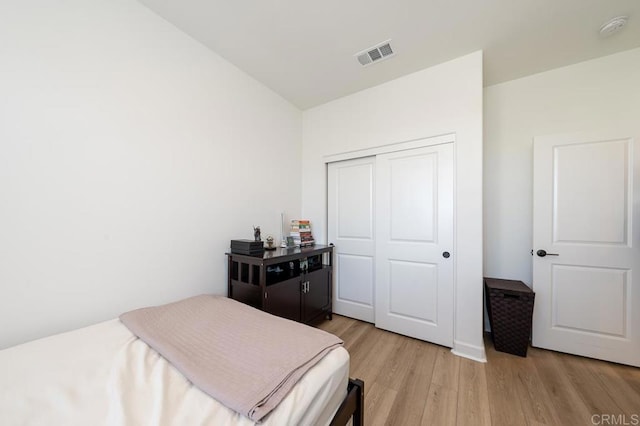 766 Makani St Unit 1, Chula Vista, CA 91911 - bedroom with light wood-style flooring, a closet, and lofted ceiling