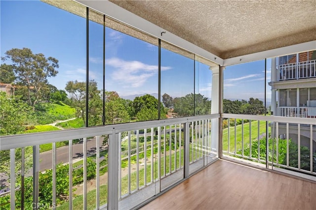 4025 Calle Sonora Este Unit 2C, Laguna Woods, CA 92637 - unfurnished sunroom featuring view of wooded area