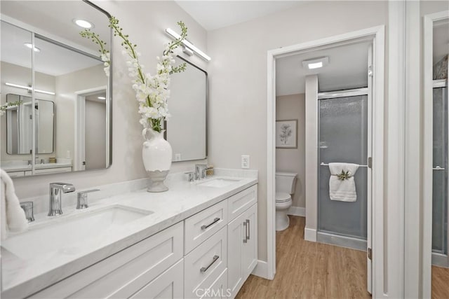 4025 Calle Sonora Este Unit 2C, Laguna Woods, CA 92637 - full bath with wood finished floors, double vanity, and a shower stall
