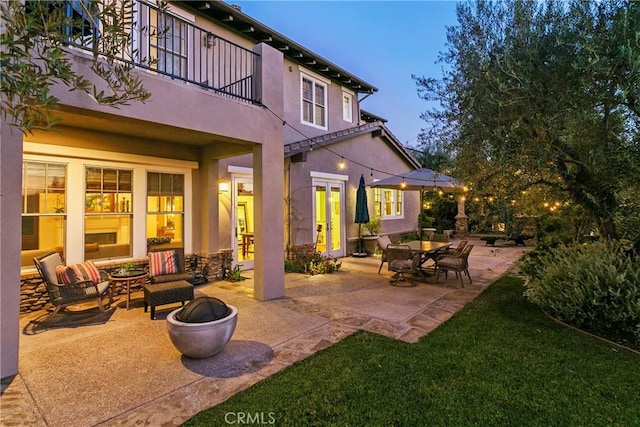 15 Pisano St, Ladera Ranch, CA 92694 - patio / terrace featuring an outdoor fire pit, a patio area, french doors, and a lawn