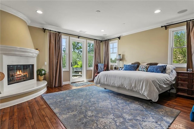 15 Pisano St, Ladera Ranch, CA 92694 - bedroom with ornamental molding, a fireplace, wood-type flooring, recessed lighting, and access to exterior