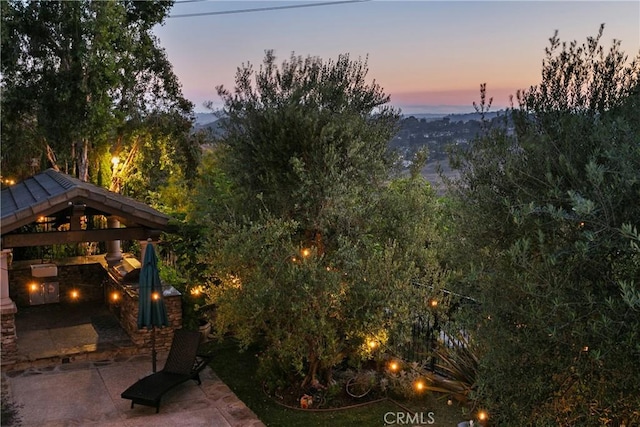 15 Pisano St, Ladera Ranch, CA 92694 - yard at dusk with a gazebo and a patio