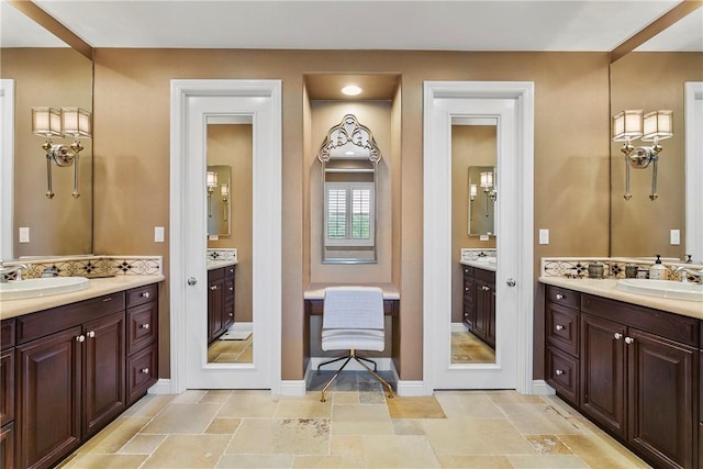 15 Pisano St, Ladera Ranch, CA 92694 - bathroom with two vanities and stone tile floors