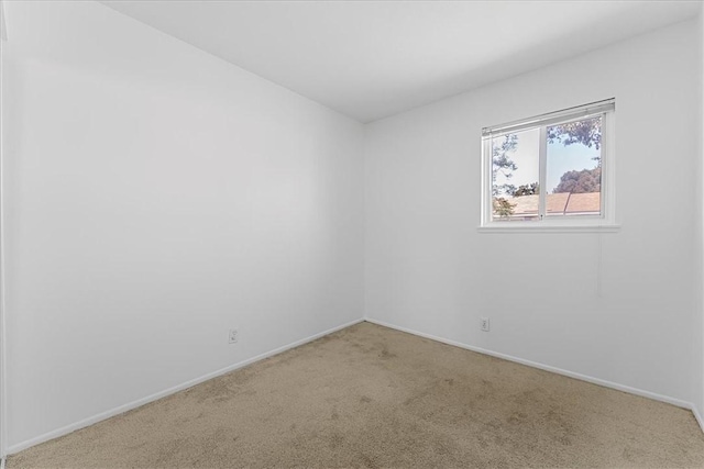 19859 Claremont Ln, Huntington Beach, CA 92646 - carpeted empty room featuring baseboards