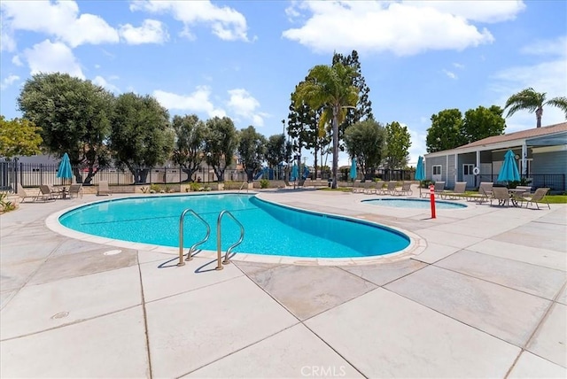 19859 Claremont Ln, Huntington Beach, CA 92646 - community pool featuring a patio area