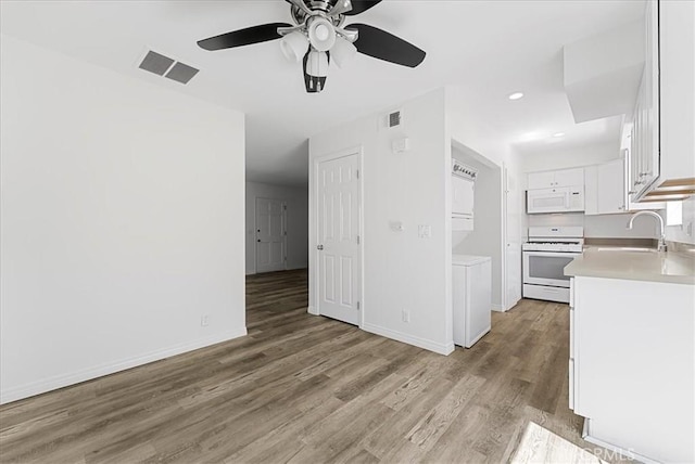 19859 Claremont Ln, Huntington Beach, CA 92646 - unfurnished living room with a ceiling fan, light wood-style flooring, and recessed lighting