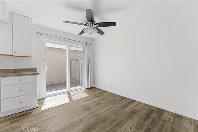 19859 Claremont Ln, Huntington Beach, CA 92646 - unfurnished dining area with wood finished floors and ceiling fan