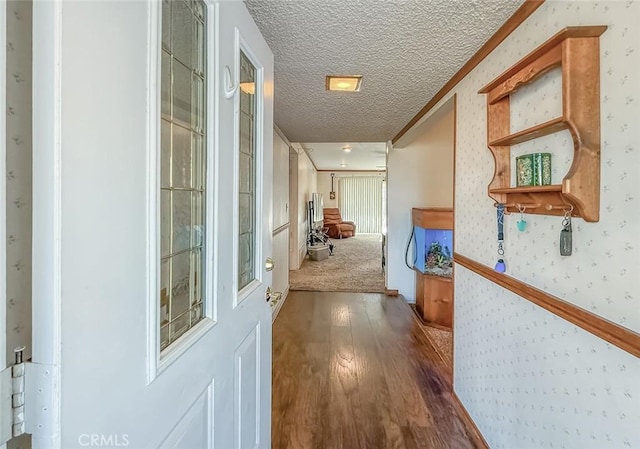 2191 Hilldale Ave, Simi Valley, CA 93063 - hallway featuring wood finished floors, wallpapered walls, a textured ceiling, and ornamental molding