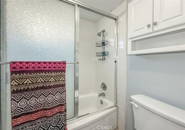 2191 Hilldale Ave, Simi Valley, CA 93063 - bathroom with bath / shower combo with glass door and toilet