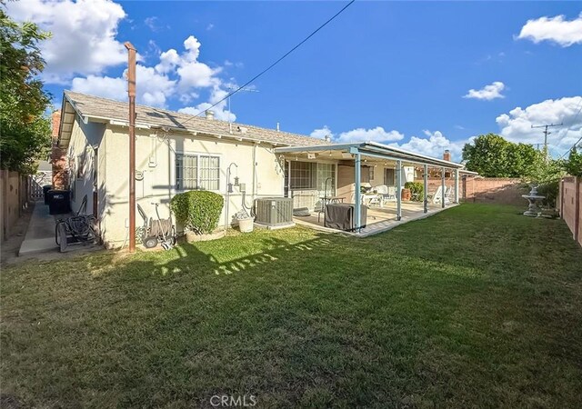 2191 Hilldale Ave, Simi Valley, CA 93063 - rear view of house featuring stucco siding, a fenced backyard, and a patio area