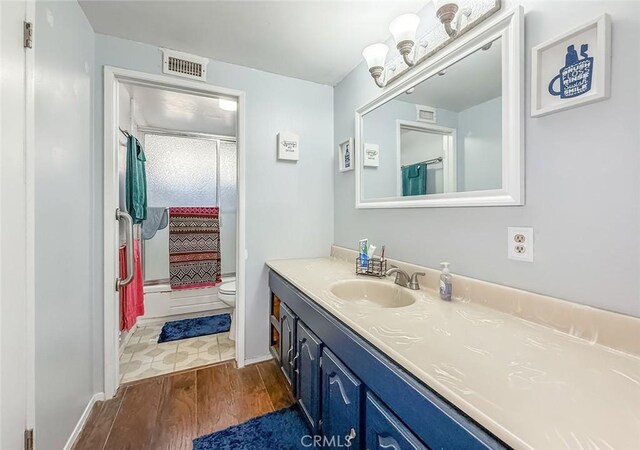 2191 Hilldale Ave, Simi Valley, CA 93063 - bathroom featuring wood finished floors, vanity, and a shower with shower curtain