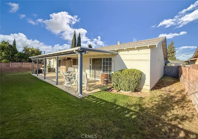 2191 Hilldale Ave, Simi Valley, CA 93063 - rear view of house with a fenced backyard, a patio area, and stucco siding