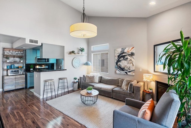 4658 Ohio St, San Diego, CA 92116 - living room with high vaulted ceiling, dark wood-type flooring, and recessed lighting