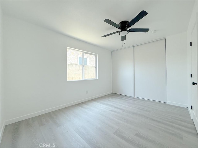 842 W Palmer St, Compton, CA 90220 - unfurnished bedroom featuring light wood finished floors, a closet, and ceiling fan