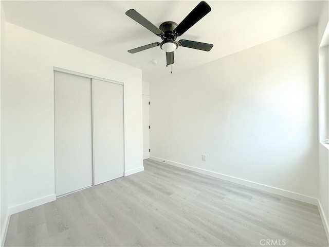 842 W Palmer St, Compton, CA 90220 - unfurnished bedroom with light wood-type flooring, a closet, and a ceiling fan
