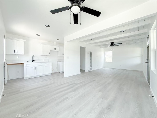 842 W Palmer St, Compton, CA 90220 - unfurnished living room featuring a ceiling fan, light wood finished floors, beamed ceiling, and recessed lighting