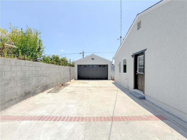 842 W Palmer St, Compton, CA 90220 - view of patio featuring a detached garage and an outdoor structure