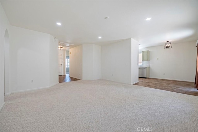 1584 Portola Way, Merced, CA 95348 - spare room featuring recessed lighting, arched walkways, and light colored carpet