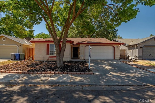 1584 Portola Way, Merced, CA 95348 - single story home featuring an attached garage, driveway, and stucco siding