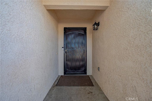 1584 Portola Way, Merced, CA 95348 - doorway to property featuring stucco siding